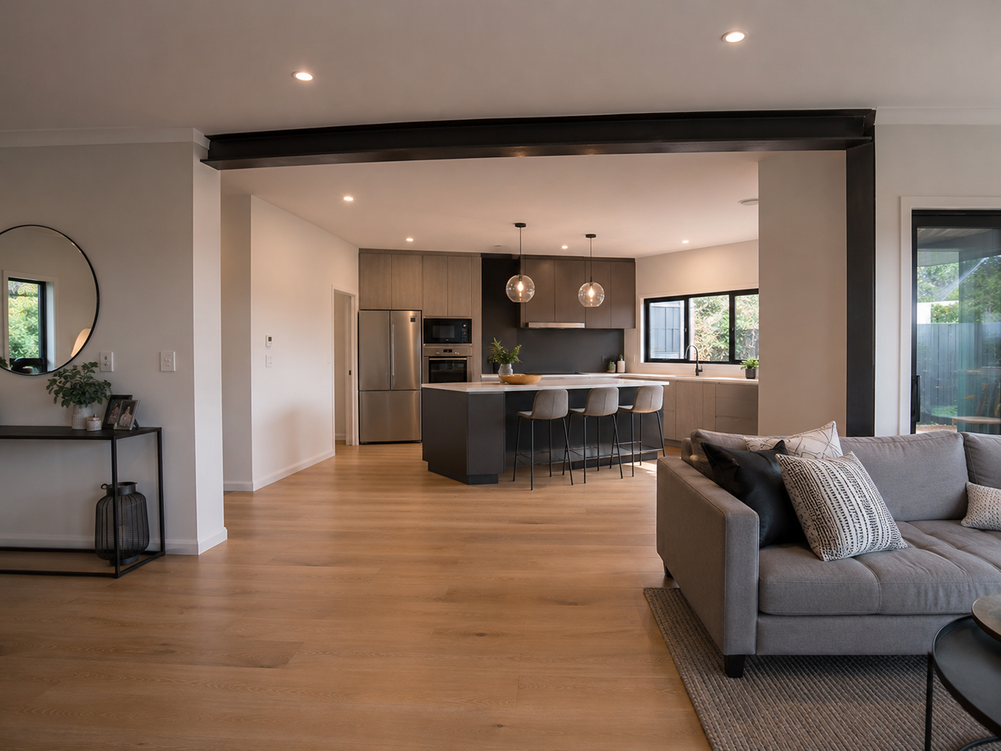 Finished open plan kitchen dining and living area after load-bearing wall removal
